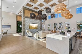 Clubhouse lobby with high ceilings and woven chandeliers